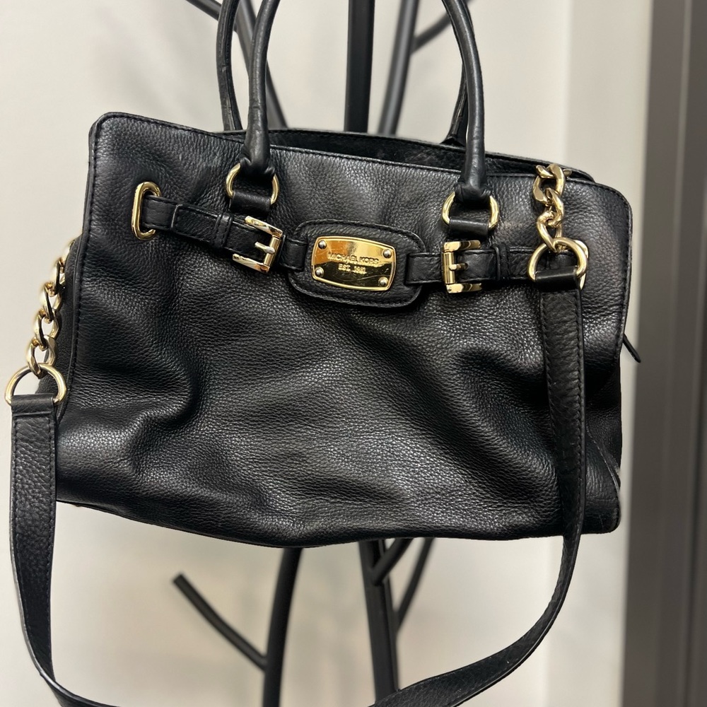 Michael Kors leather purse. Make up stains inside.